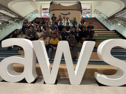 Students and AWS community speakers gathered on the AWS Singapore staircase